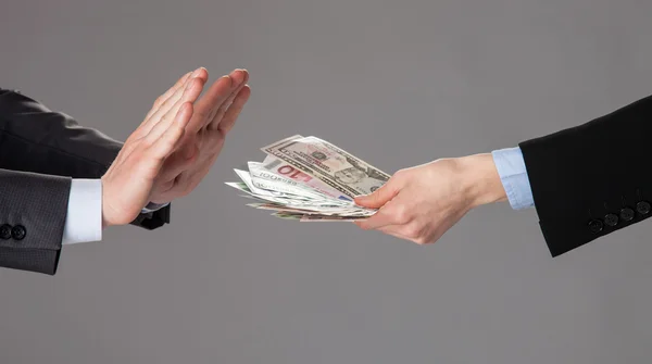 Businessman's hands rejecting a bribe — Stock Photo, Image