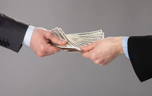 Human hands accepting an offer of money — Stock Photo, Image