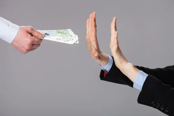 Businessperson's hands rejecting an offer of money — Stock Photo, Image