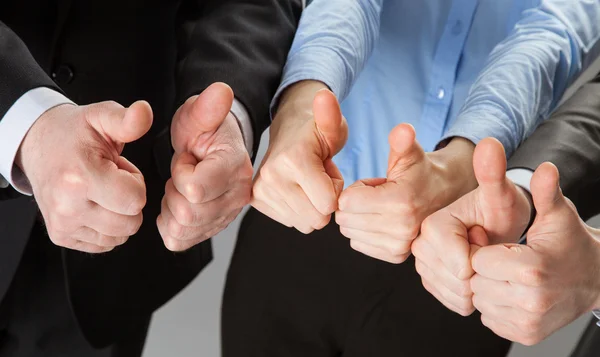 Successful business team showing thumbs up — Stock Photo, Image
