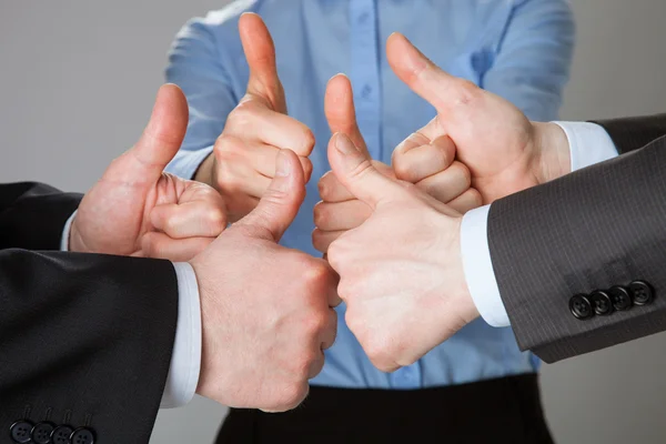Successful business team showing thumbs up — Stock Photo, Image