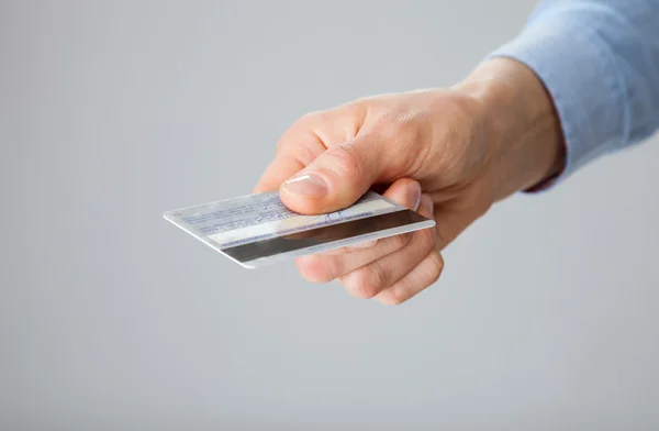 Businesswoman reaching out credit card — Stock Photo, Image