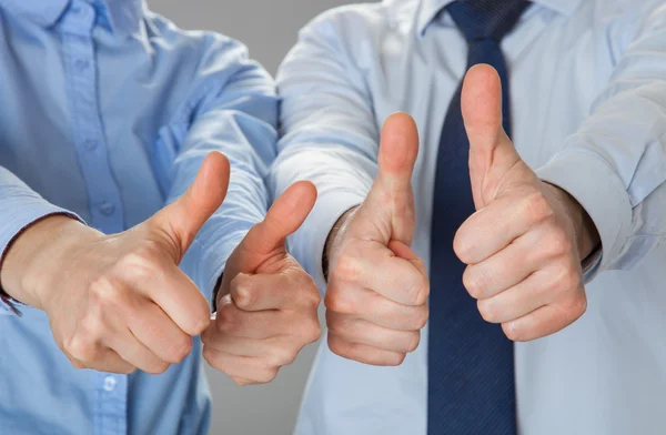 Successful team showing thumbs up — Stock Photo, Image