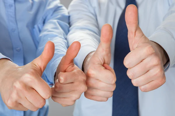 Successful team showing thumbs up — Stock Photo, Image