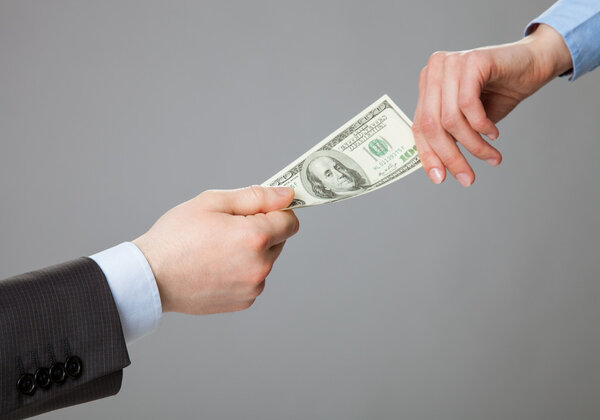 Business people hands exchanging money