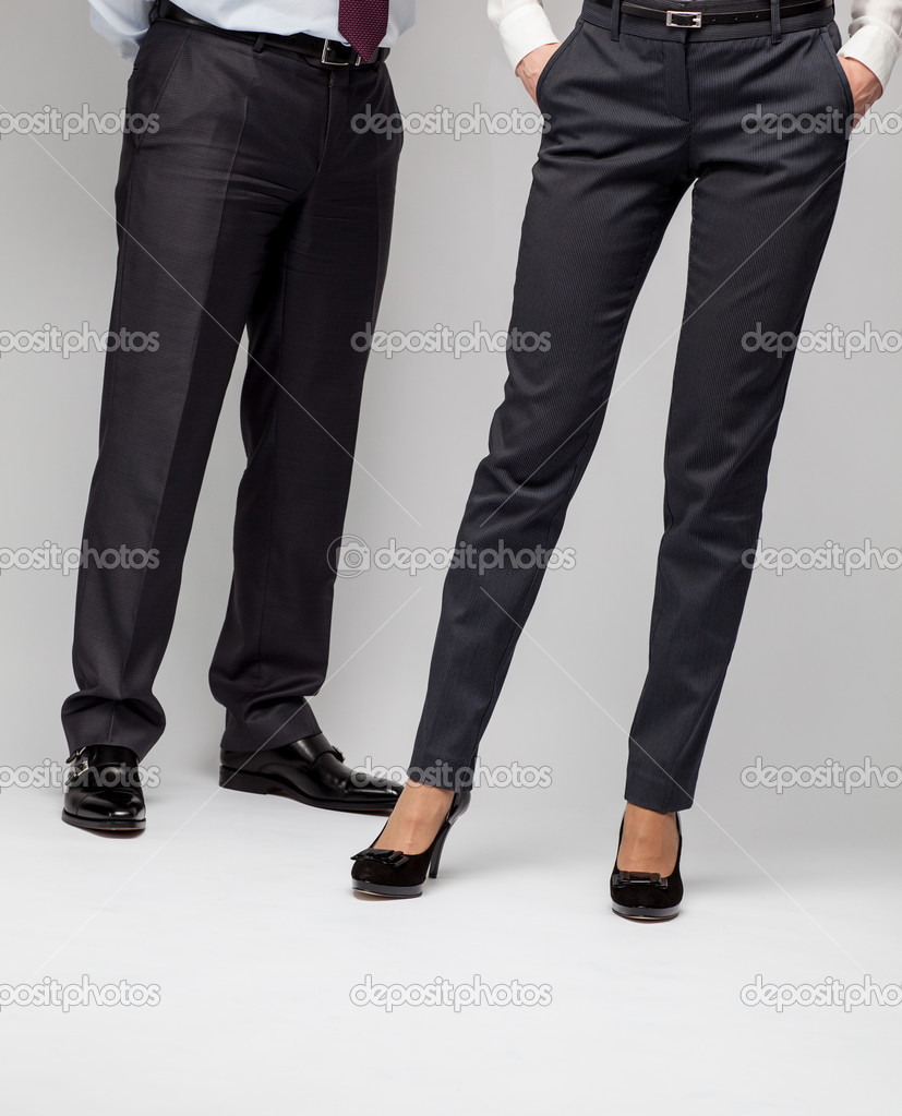 Elegant businessman and business lady - closeup of legs