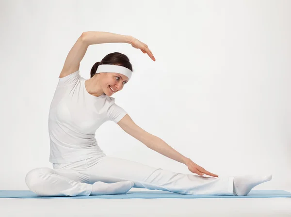 Happy young woman doing exercises — Stock Photo, Image