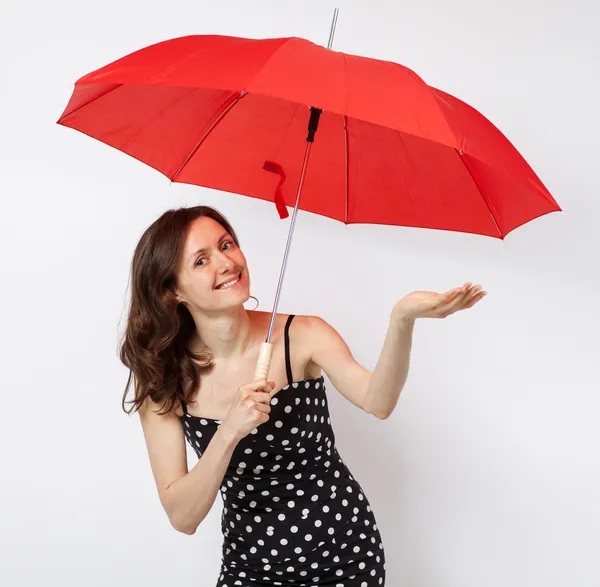 Pretty young woman in dress with open umbrella — Stock Photo, Image