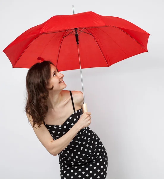 Pretty young woman in dress with open umbrella — Stock Photo, Image