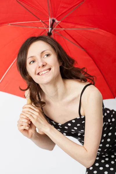 Adorable young woman in dress with open umbrella — Stock Photo, Image