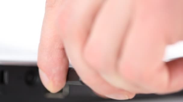 Man's hand connects removable usb memory to laptop — Stock Video