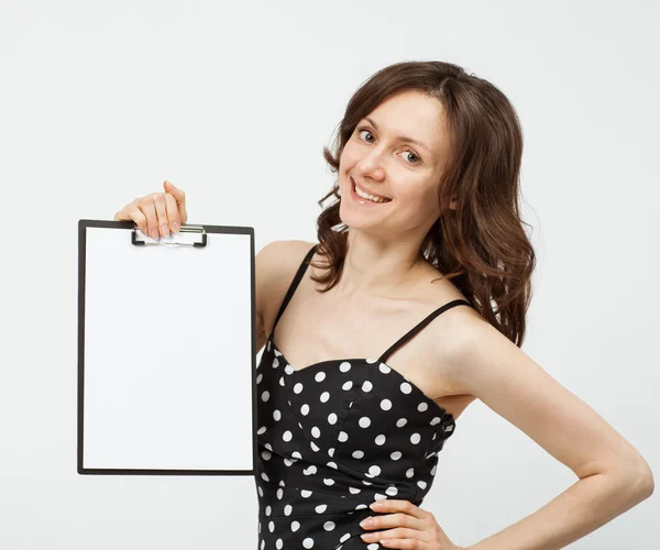 Attractive young woman showing clipboard — Stock Photo, Image