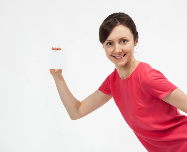 Playful young woman showing blank white card — Stock Photo, Image