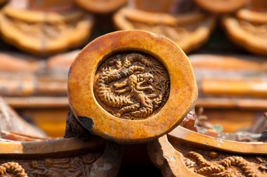 Dragon detail on roof tile, Forbidden City, Beijing clipart