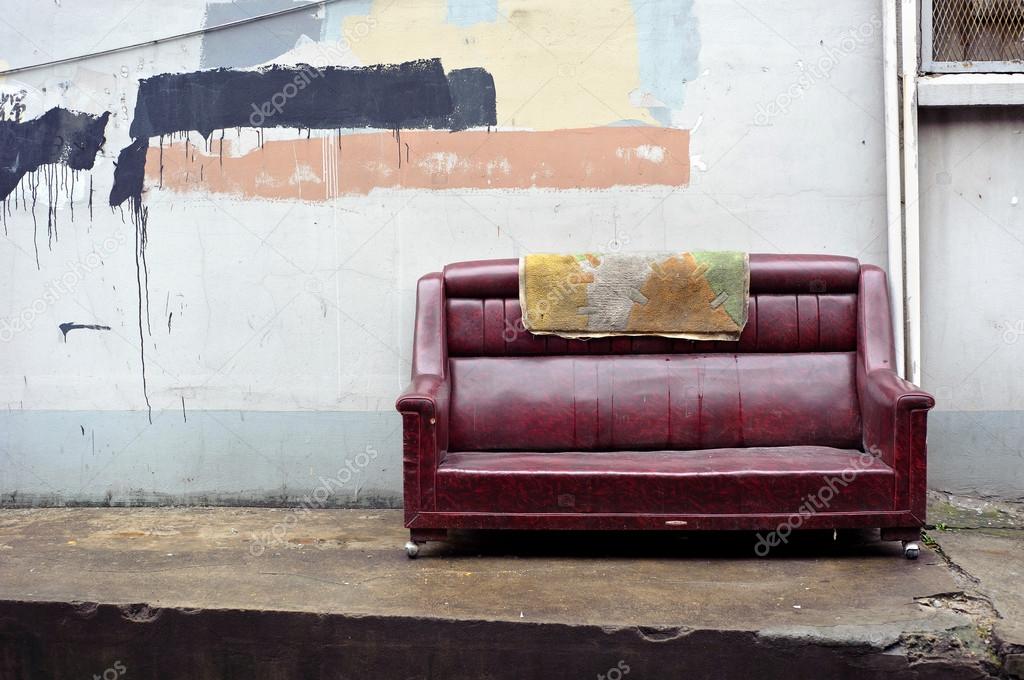 Old abandoned couch dumped on the street