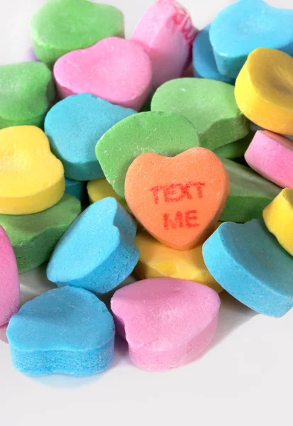 Valentine Bonbonherzen "Text mir" Stockbild