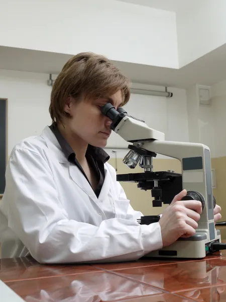 Scientist with microscope — Stock Photo, Image