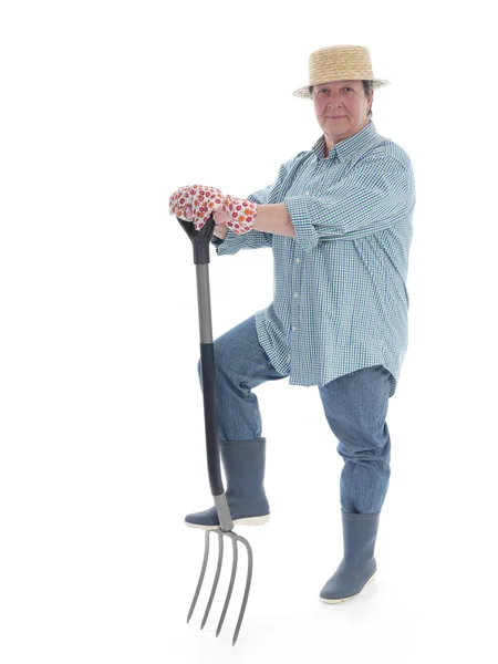 Senior gardener with forks — Stok fotoğraf