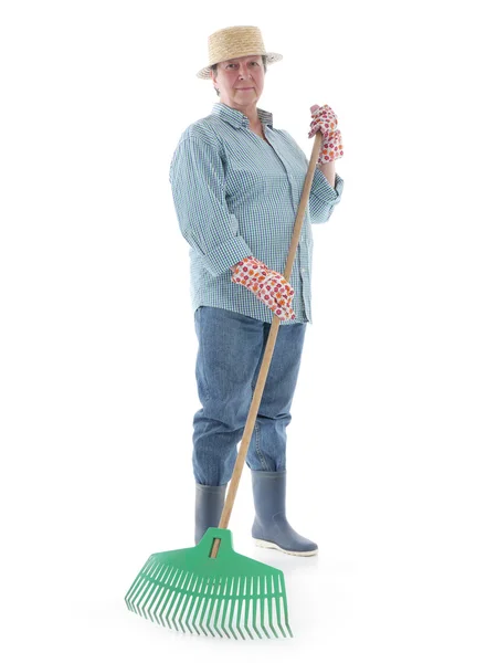 Giardiniere senior con rastrello — Foto Stock