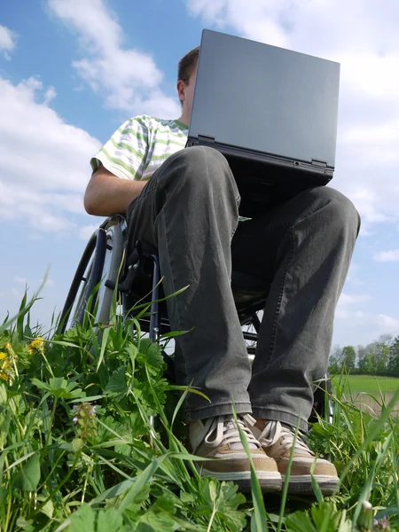 Handicapped man with laptop — Stock Photo, Image