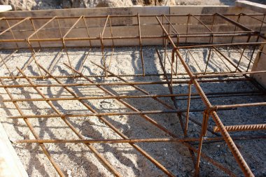 Closeup of house foundation steel reinforcement bars