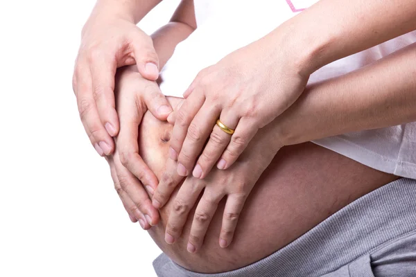 Precioso embarazada con su marido usado mano tocado torso — Foto de Stock