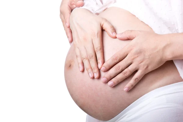 Vackra gravid med sin make används hand rört torso — Stockfoto