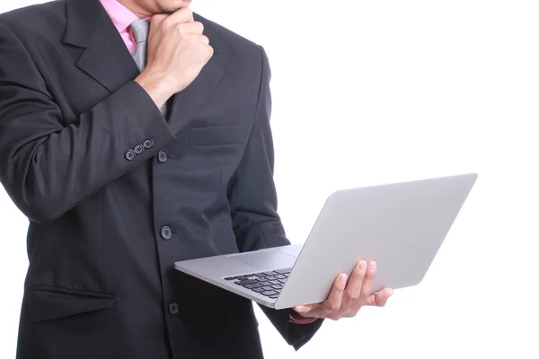 Empresário chave algo com seu laptop — Fotografia de Stock