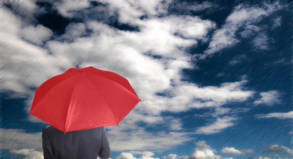 Leader holding red umbrella for show different think — Stock Photo, Image