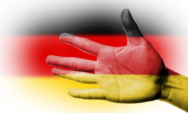 あなたの手でドイツの国旗を塗るとファンの応援 — ストック写真