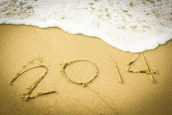 2014 wrote on the beach Stock Photo
