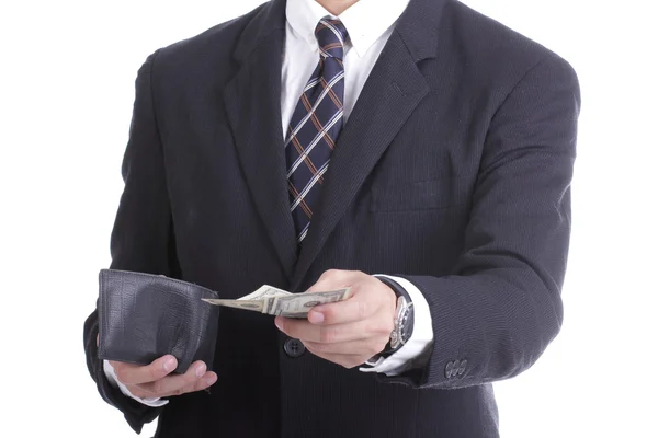 Uomo d'affari che mette soldi in dollari per pagare qualcosa — Foto Stock