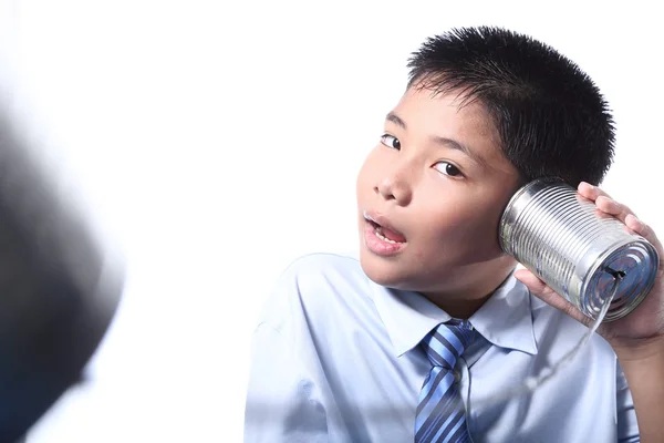 Lovely boy listen tin can telephone — Stock Photo, Image