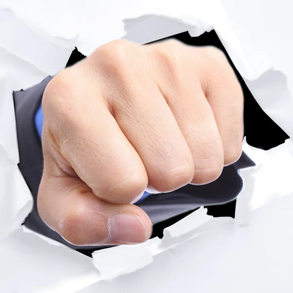 Businessman punch through white paper — Stock Photo, Image