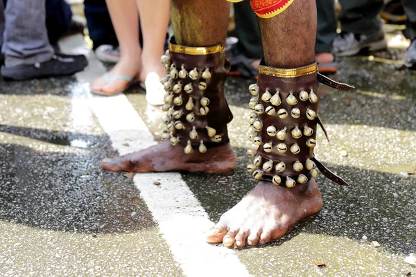 Close up devotee's leg with small bells — Stock Photo, Image