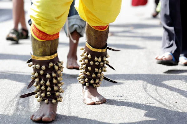 Close up devotee's leg with small bells — Stock Photo, Image