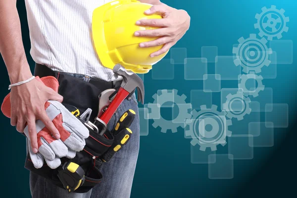 Worker holding tool for working — Stock Photo, Image