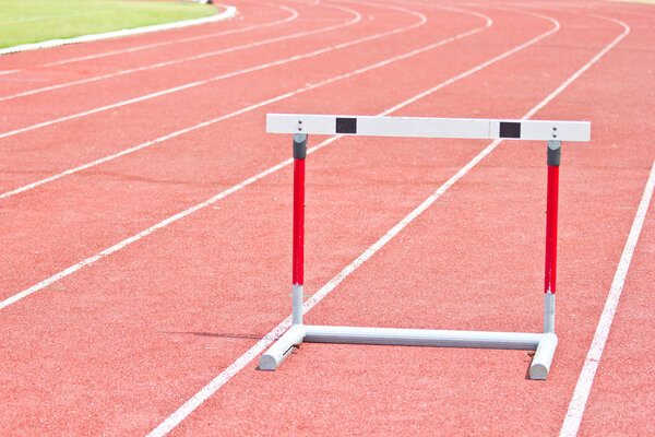 hurdles on the red running track