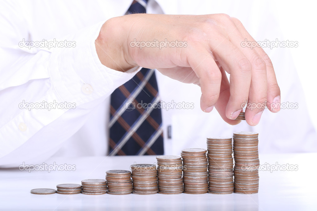 Businessman put coin stack money