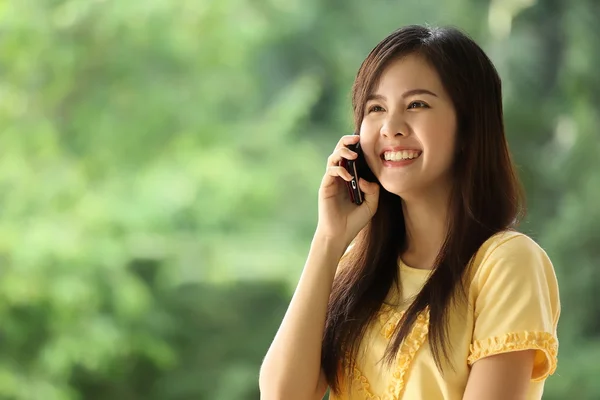 Portrait lovely girl type information with her mobile phone — Stock Photo, Image