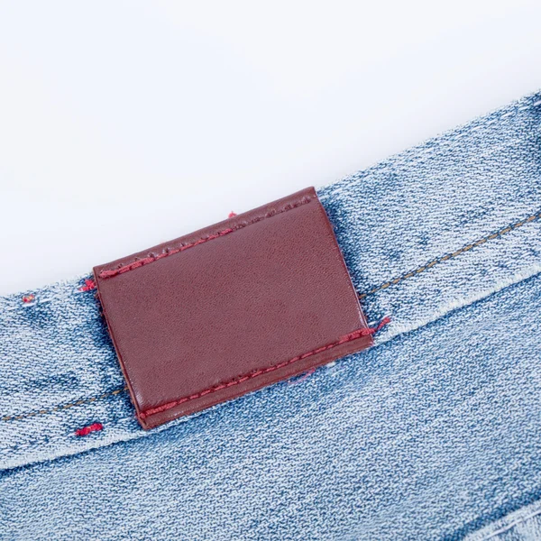 Lege lederen label weergave van jeans — Stockfoto