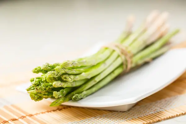 Bunch of fresh asparagus tie — Stock Photo, Image