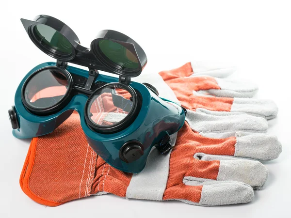 Construction gloves and goggles glasses — Stock Photo, Image