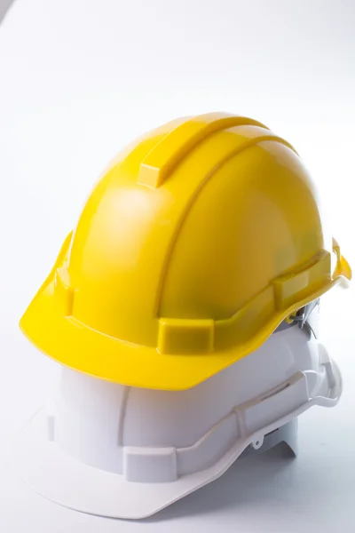 Safety hat isolated with alram clock — Stock Photo, Image