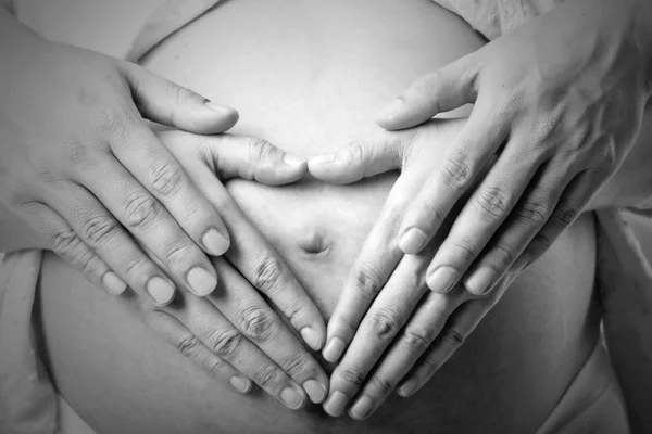 Lovely pregnant with her husband used hand  touched torso — Stock Photo, Image