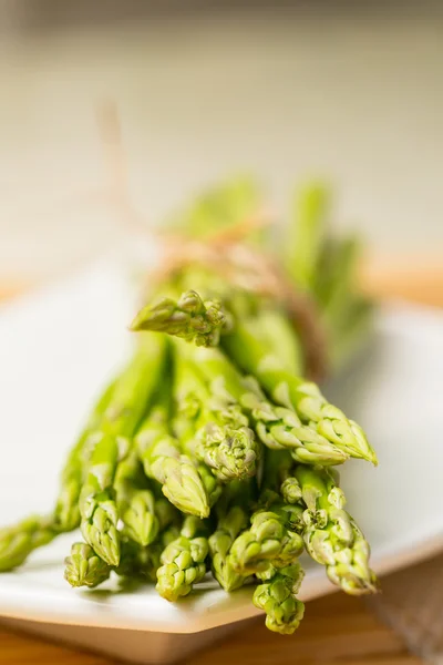 Bunch of fresh asparagus tie — Stock Photo, Image
