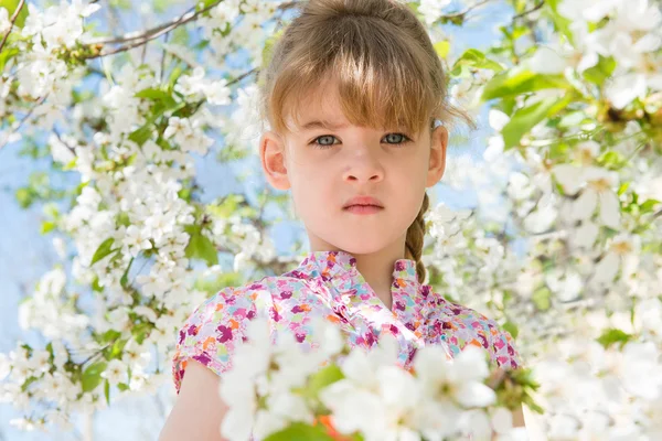 Little girl with flowers — Stock Photo, Image