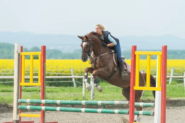 Girl jumping with horse — Stock Photo, Image