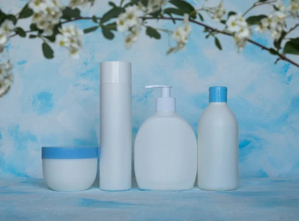 Bottles for cosmetic products without a label. Facial skin care concept. Texture background, canvas.