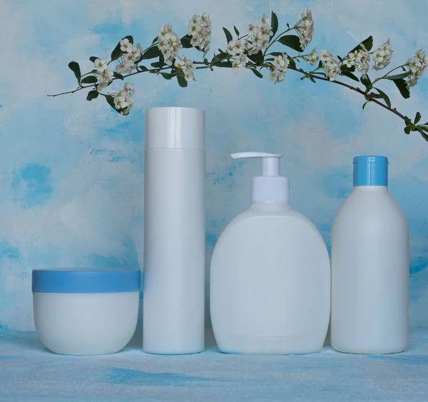 Bottles for cosmetic products without a label. Facial skin care concept. Texture background, canvas.
